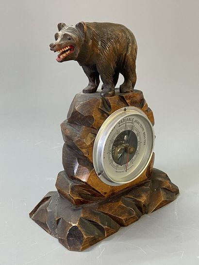 Baromètre en bois sculpté, surmonté d'un...