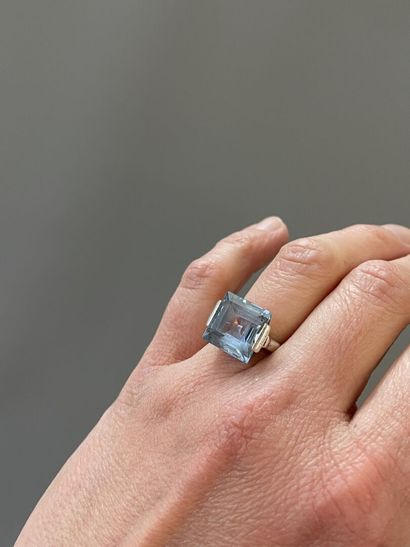 White gold ring, set with a square aquamarine...
