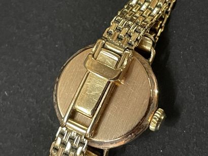 Montre bracelet de dame en or 750°/00.

L:...