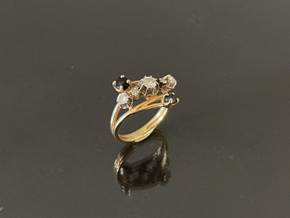 Gold ring set with five diamonds, highlighted...