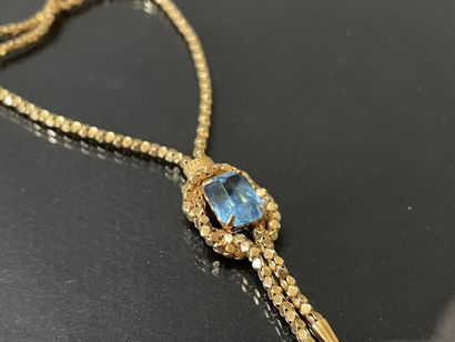 Necklace in gold 750°/00 set with a blue...