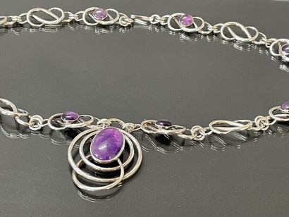 Important collier en argent orné de cabochons...