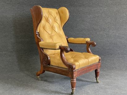 Fauteuil à mécanisme en acajou, garni de...