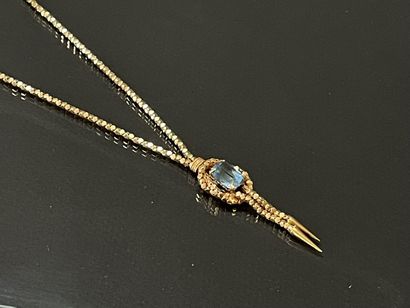 Necklace in gold 750°/00 set with a blue...