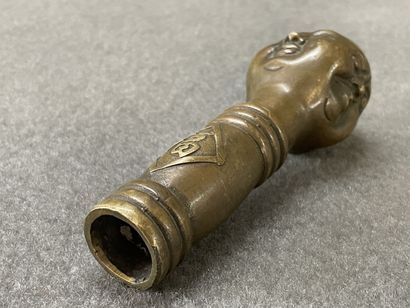 Asian cane knob in bronze representing the...