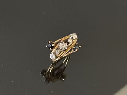 Gold ring set with five diamonds, highlighted...