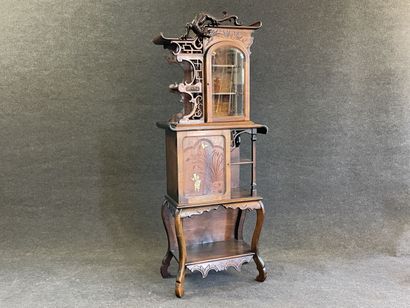 Mahogany japanese showcase, topped by a carved...