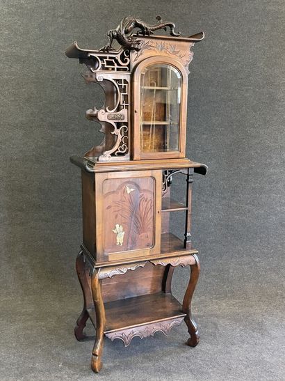 Mahogany japanese showcase, topped by a carved...