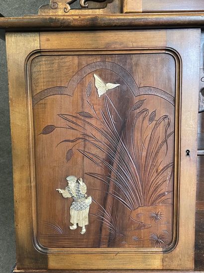 Mahogany japanese showcase, topped by a carved...