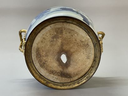Old vase transformed into a pot holder in...