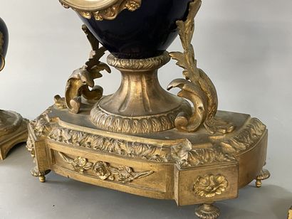 Gilded bronze and blue porcelain mantel set...