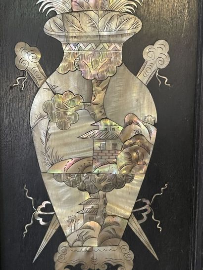 Pair of blackened wood plates with rich mother-of-pearl

representing...