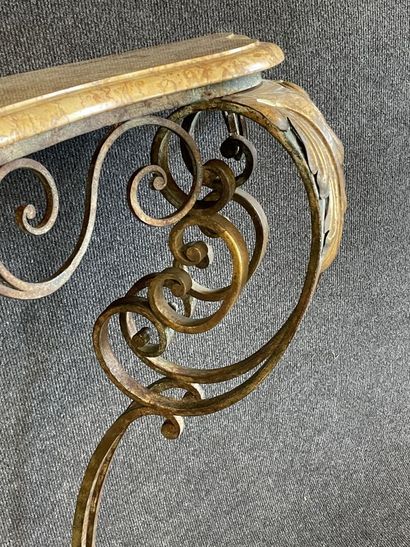 Wrought iron console with marble top.

Louis...