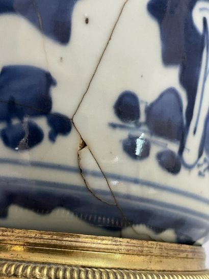 Old vase transformed into a pot holder in...