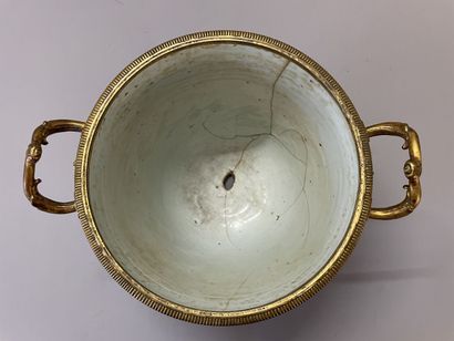 Old vase transformed into a pot holder in...