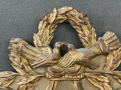 Wood and gilded stucco pediment mirror decorated...