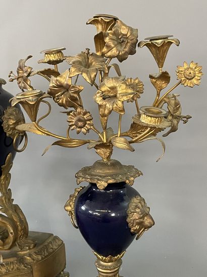 Gilded bronze and blue porcelain mantel set...