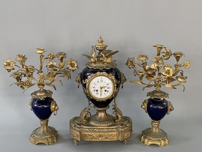 Gilded bronze and blue porcelain mantel set...