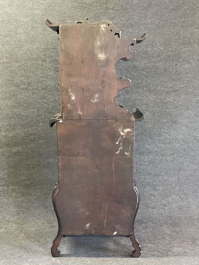 Mahogany japanese showcase, topped by a carved...