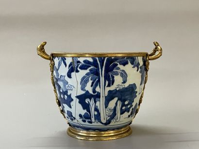 Old vase transformed into a pot holder in...