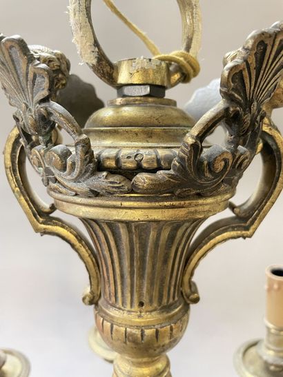 Bronze chandelier with eight lights.

Regency...