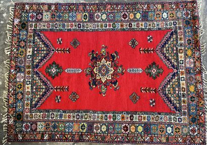 Large Moroccan carpet red background.

287...