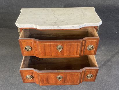Inlaid chest of drawers, with central projection,...