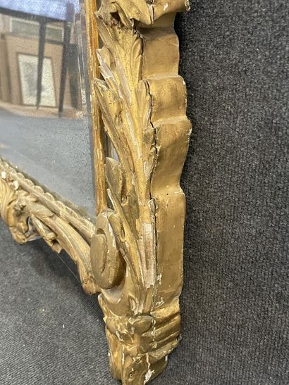 Wood and gilded stucco mirror, pediment showing...