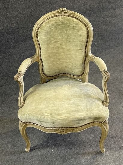 Carved and lacquered wood cabriolet armchair.
Stamped...