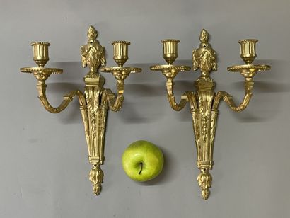 Pair of bronze sconces with two lights.
Louis...