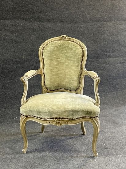 Carved and lacquered wood cabriolet armchair.
Stamped...