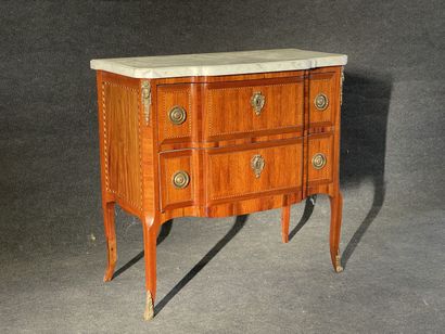 Inlaid chest of drawers, with central projection,...