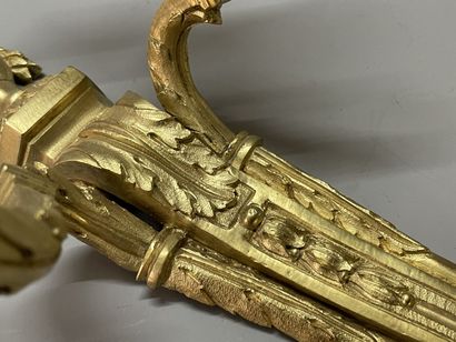Pair of bronze sconces with two lights.
Louis...
