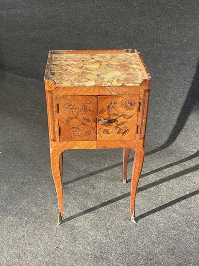 Table inlaid with flowers and frieze, top...