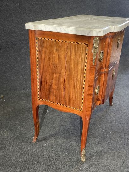 Inlaid chest of drawers, with central projection,...