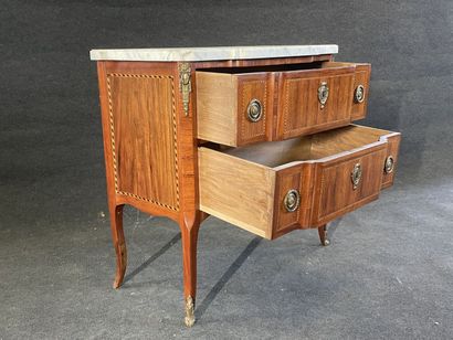Inlaid chest of drawers, with central projection,...
