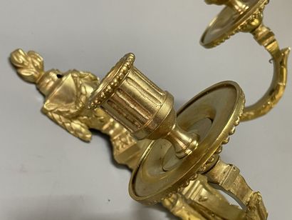 Pair of bronze sconces with two lights.
Louis...