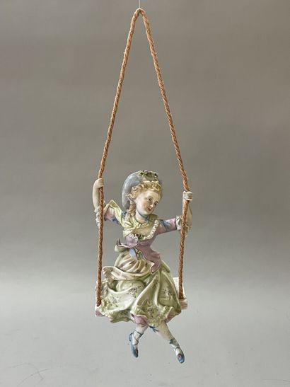 Jeune fille sur une balançoire
Statuette...