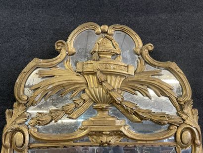 Wood and gilded stucco mirror, pediment showing...