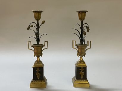 Pair of candlesticks in gilded and patinated...