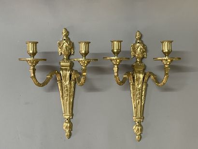 Pair of bronze sconces with two lights.
Louis...