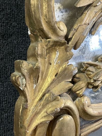 Wood and gilded stucco mirror, pediment showing...