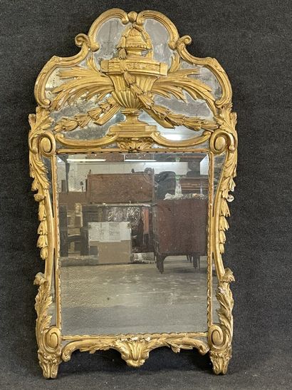 Wood and gilded stucco mirror, pediment showing...