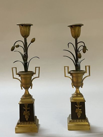 Pair of candlesticks in gilded and patinated...