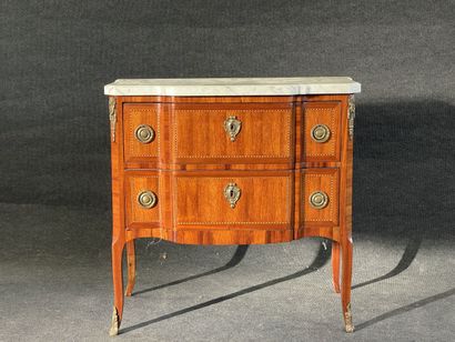 Inlaid chest of drawers, with central projection,...