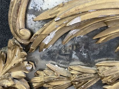 Wood and gilded stucco mirror, pediment showing...