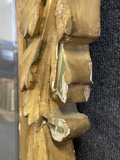 Wood and gilded stucco mirror, pediment showing...
