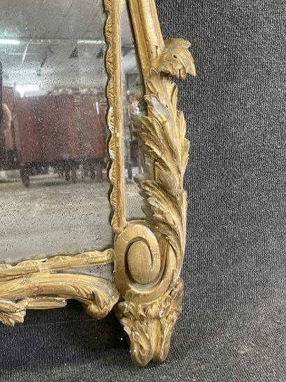 Wood and gilded stucco mirror, pediment showing...