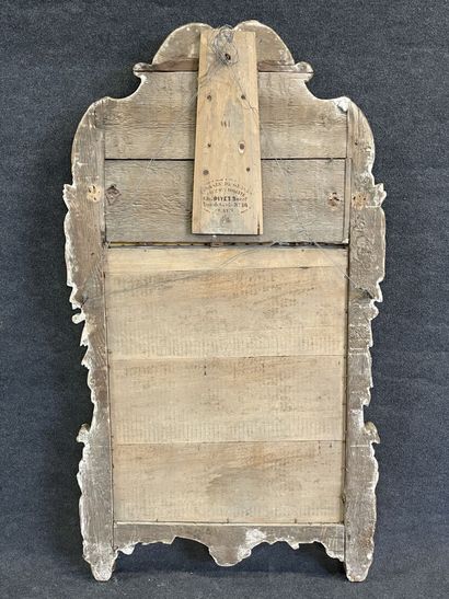 Wood and gilded stucco mirror, pediment showing...
