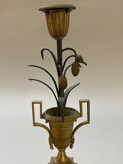 Pair of candlesticks in gilded and patinated...
